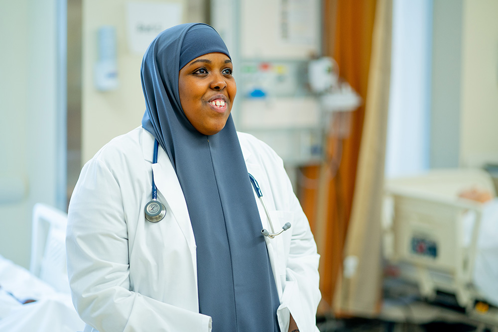 Woman smiling in nursing lab