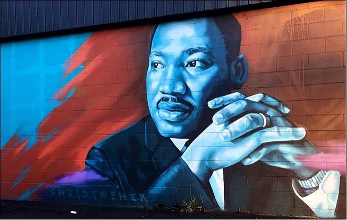Rev. Dr. Martin Luther King Jr. depicted in a colorful mural. 