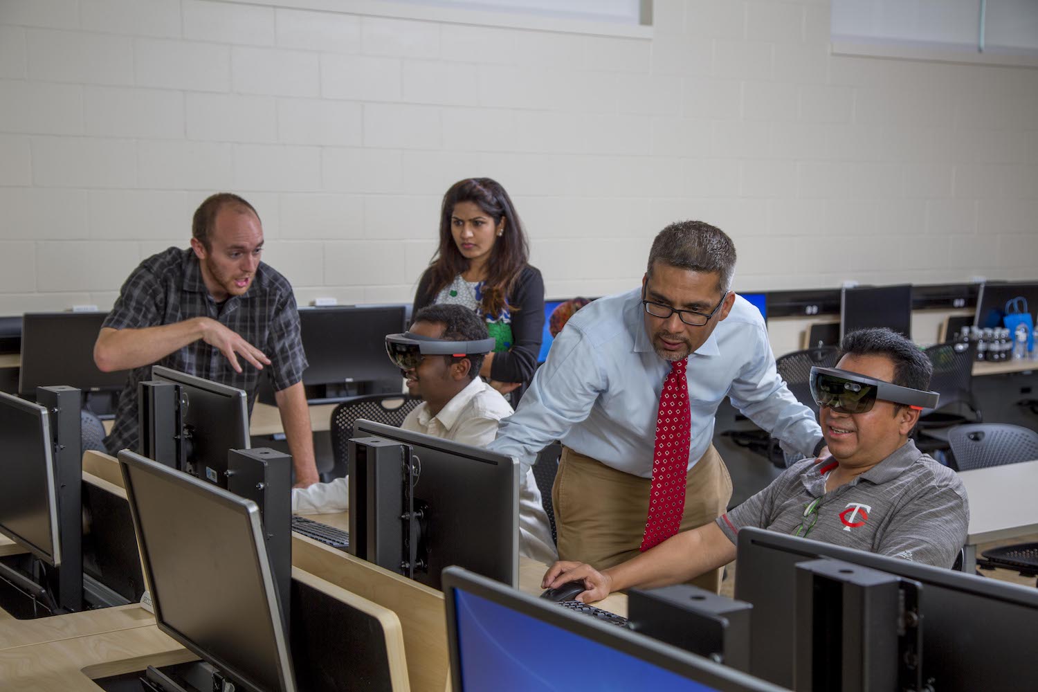 faculty and students in computer lab with virtual reality headsets