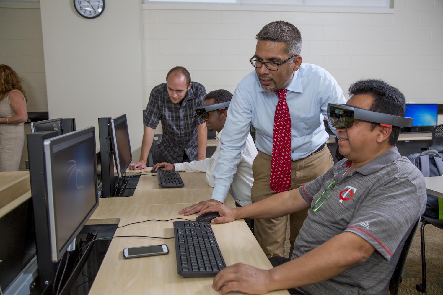 faculty and students in cybersecurity lab