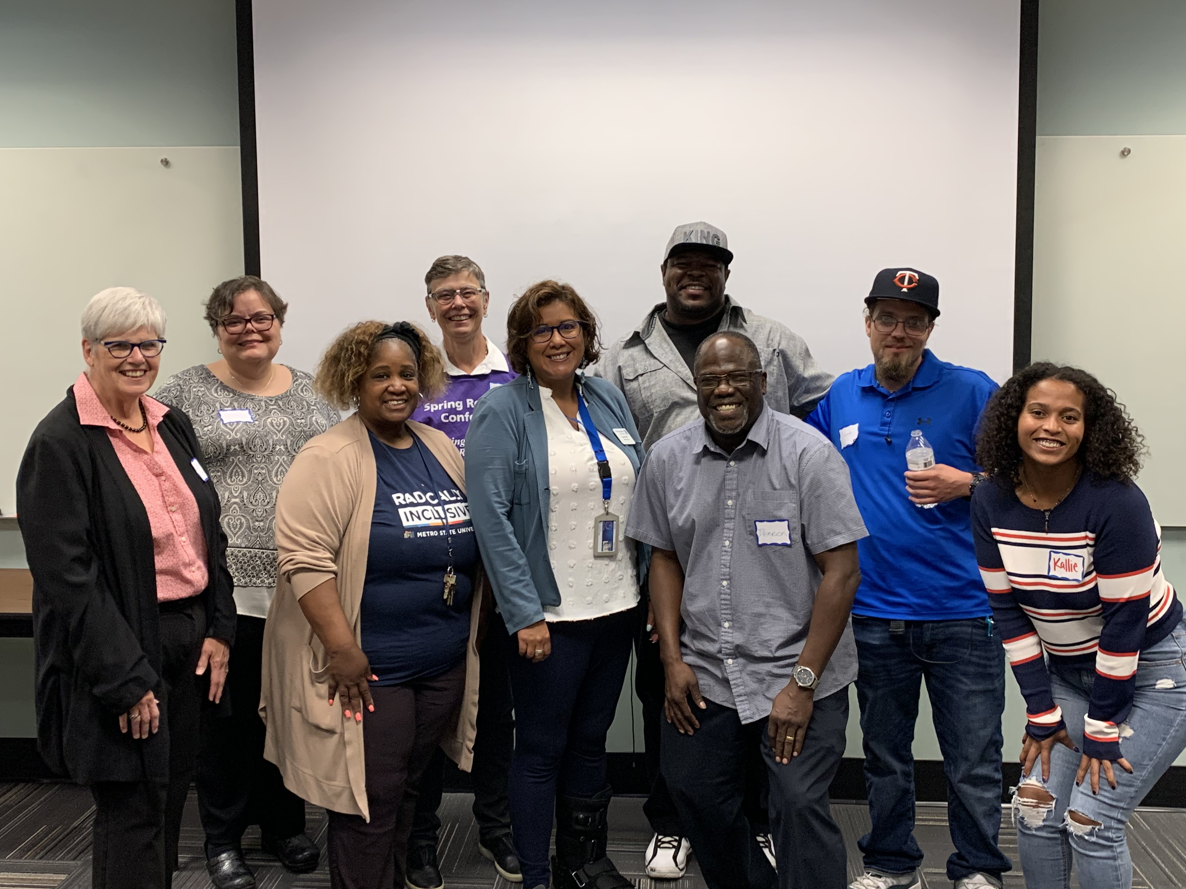 A group of Metro State administration, faculty, staff, and students pose for a group photo