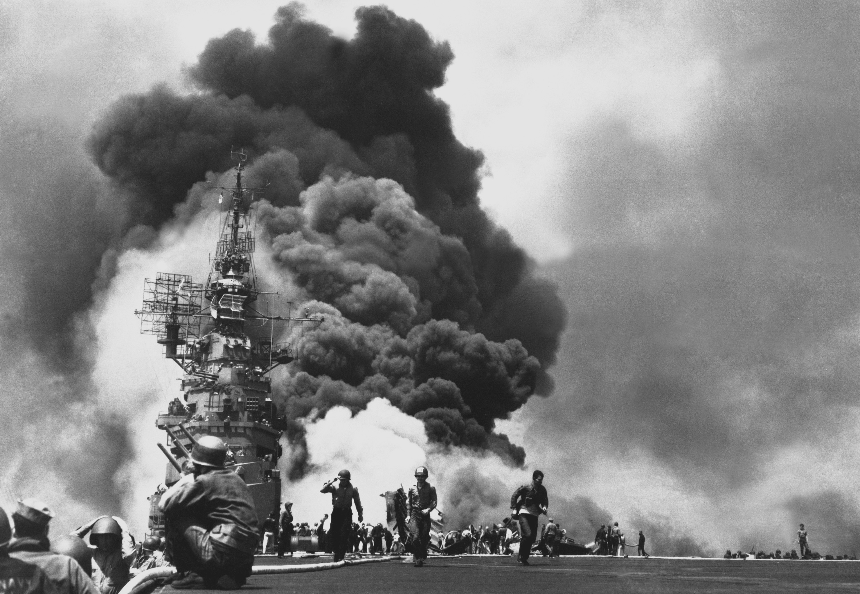 Aircraft carrier USS Bunker Hill burns after being hit by two kamikaze planes within 30 seconds.