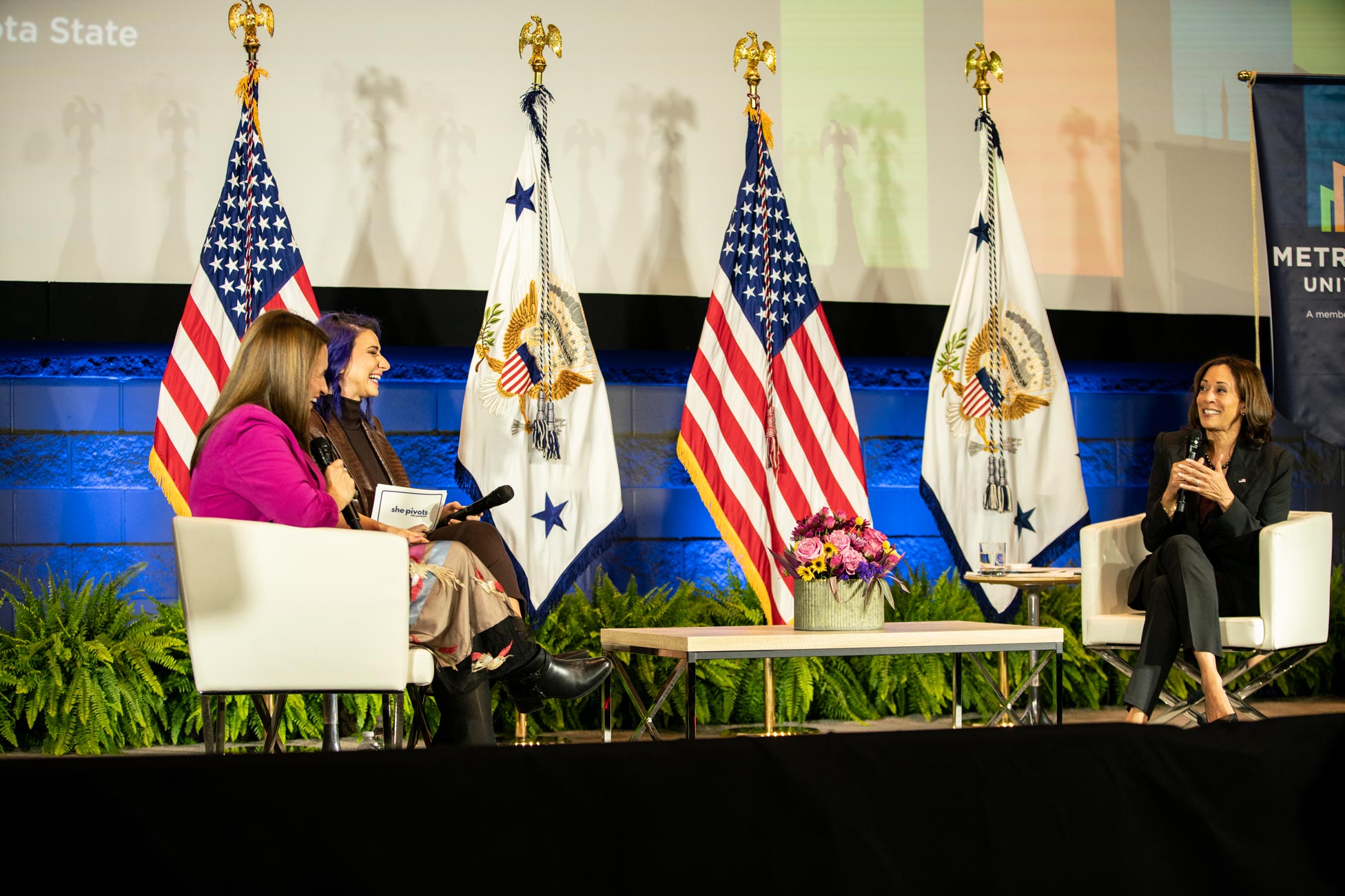 Minnesota Lieutenant Governor Peggy Flanagan, "She Pivots" podcast host Emily Tisch Sussman, and U.S. Vice President Kamala Harris discuss reproductive rights on the Metro State Auditorium Stage