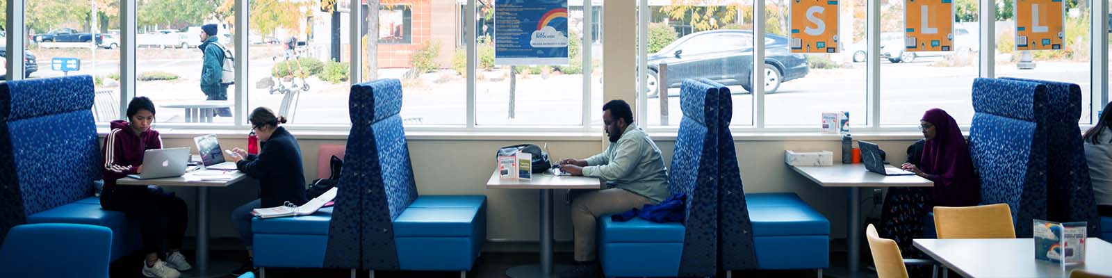 Students seated in booths