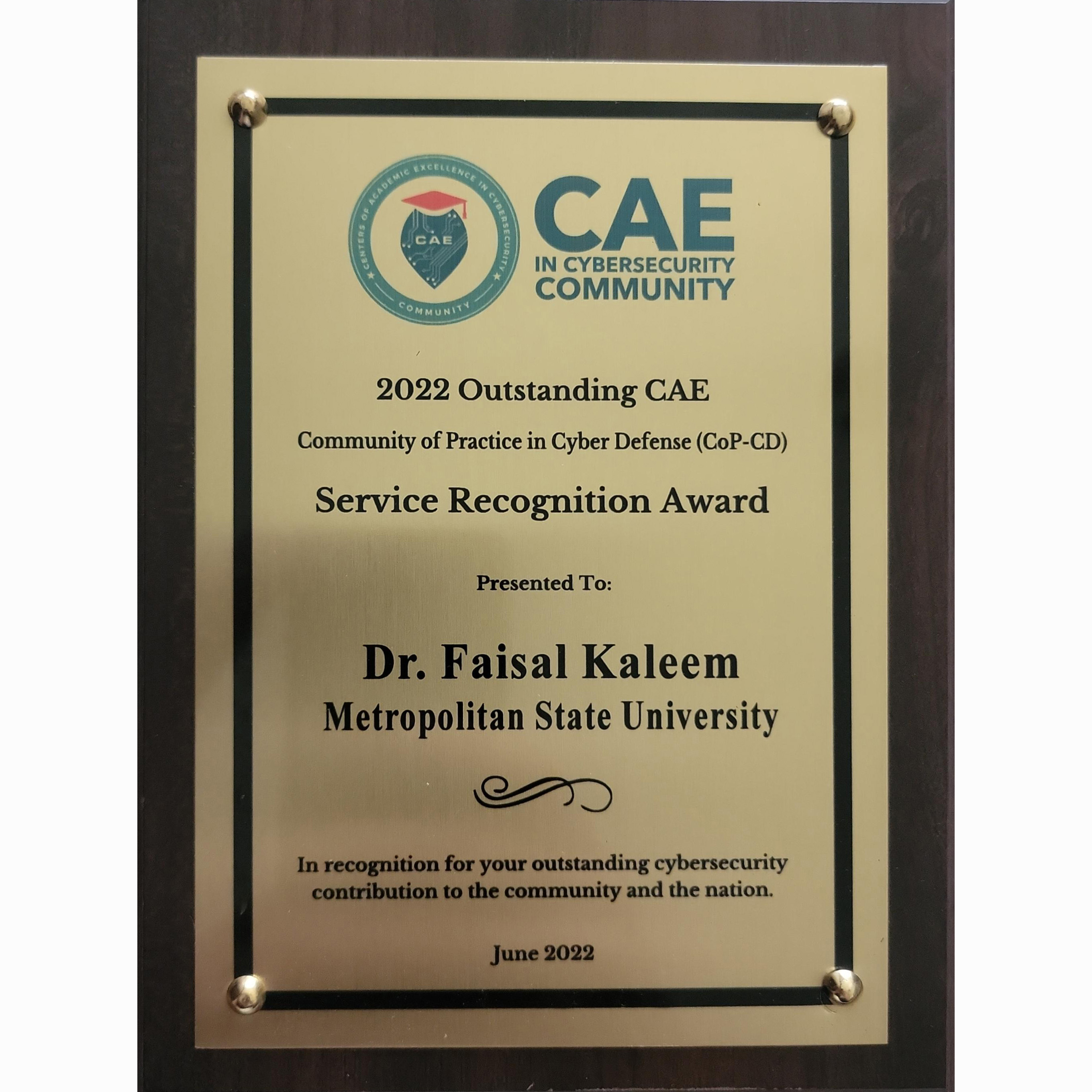 An image of a CAE in Cybersecurity Community plaque honoring Dr. Faisal Kaleem with a 2022 Outstanding CAE Service Recognition award