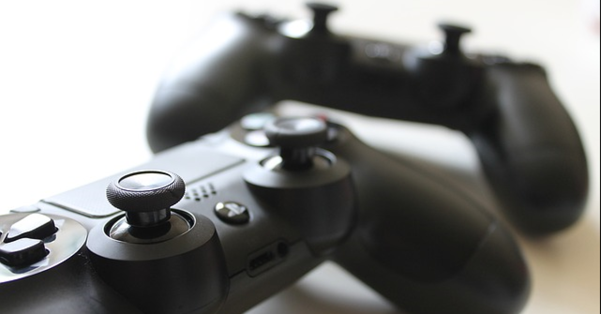 Two Xbox video game controllers