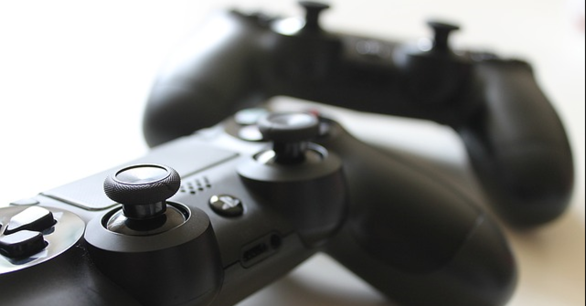 Two Xbox video game controllers