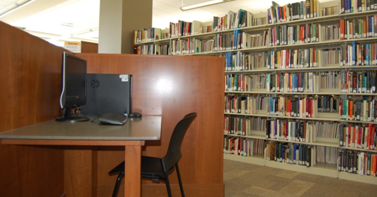 Library computer station and books