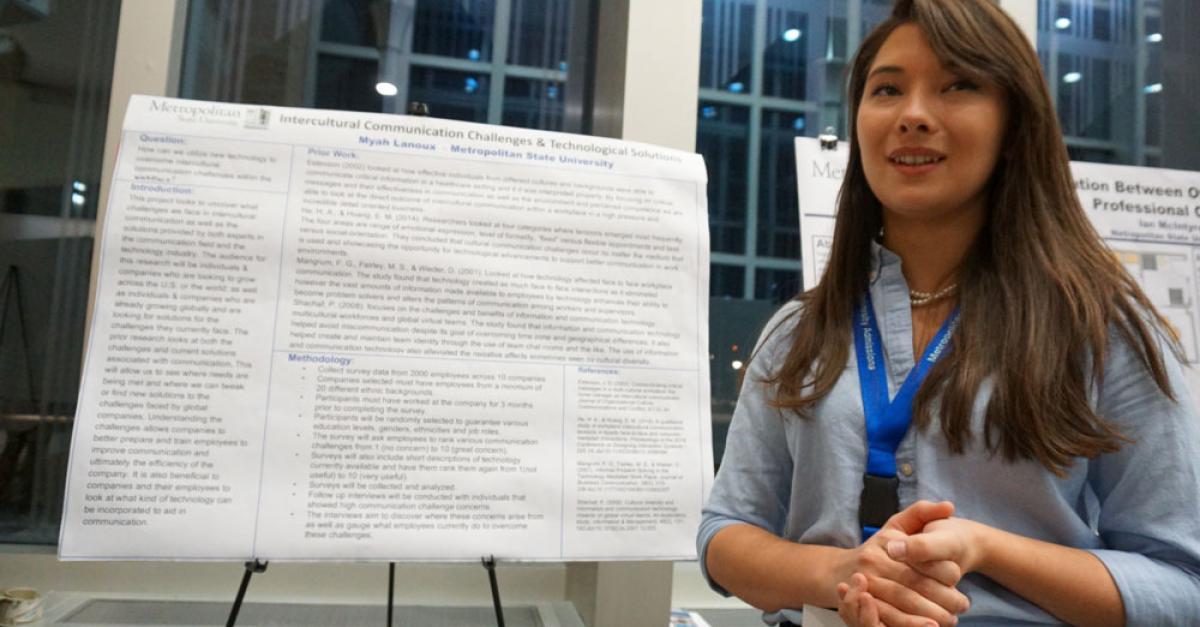 Student presenting poster