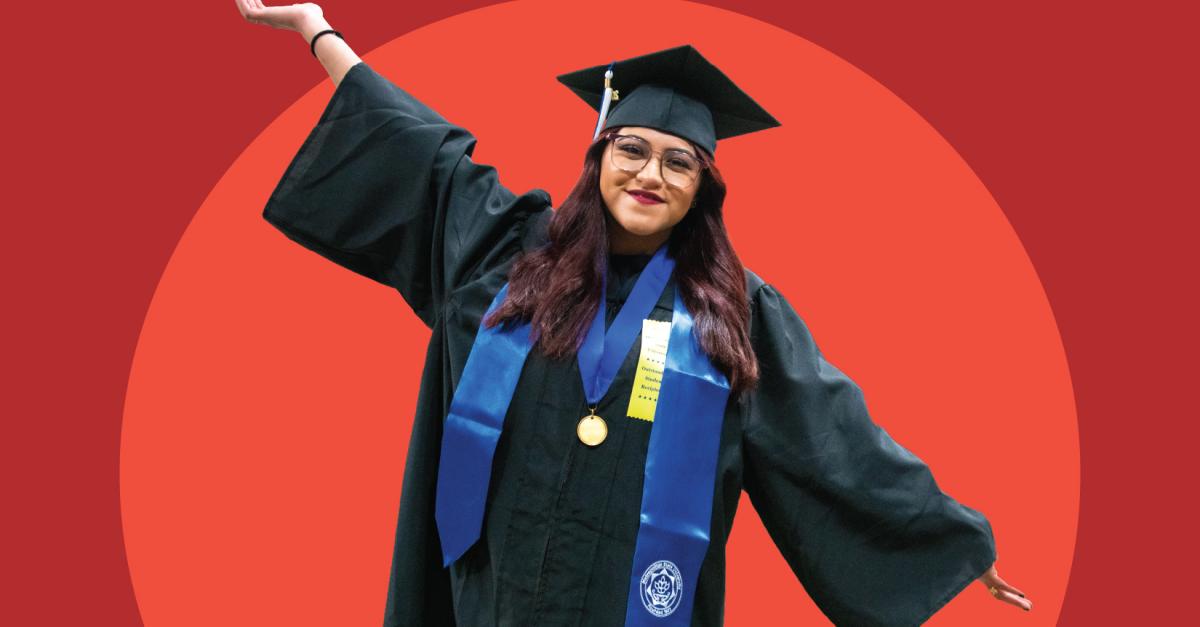 A person in cap and gown with their arms spread wide poses against a red background