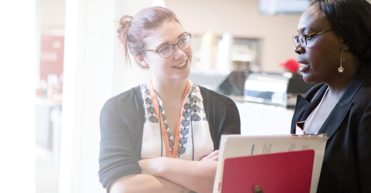 photo of a student speaking with an admissions advisor
