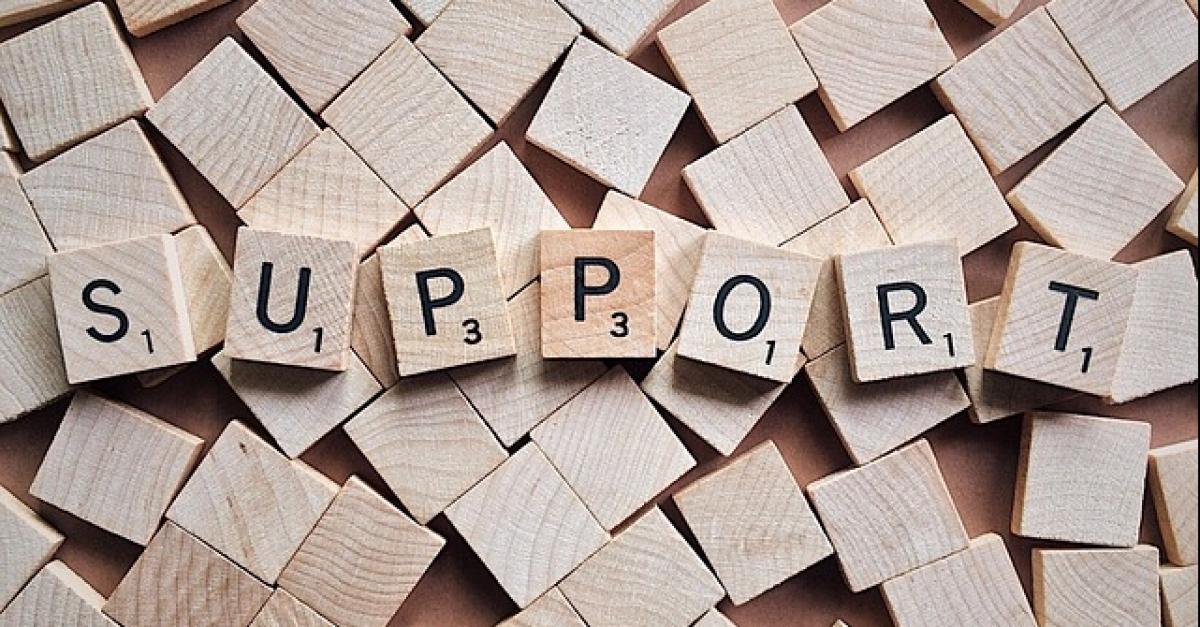 Scrabble letters spelling support