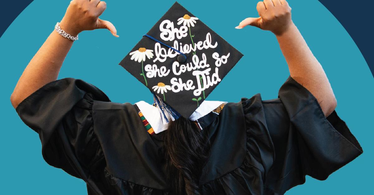 A blue background with a person in cap and gown, facing away, with She believed she could, so she did