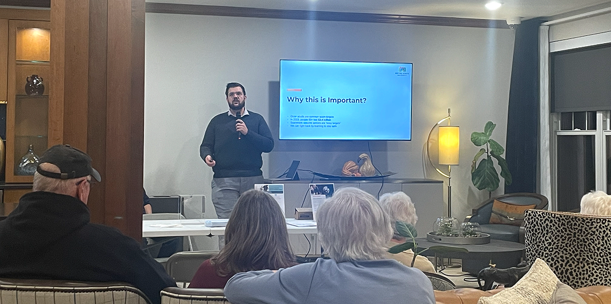 a person standing to speak to a room of people