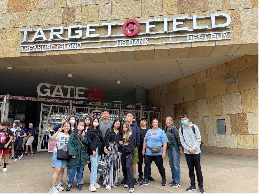 Group of students pose in front of Target Field