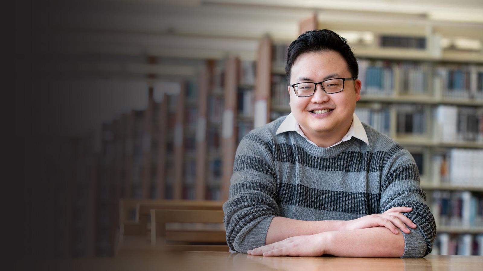 a student posing in the library