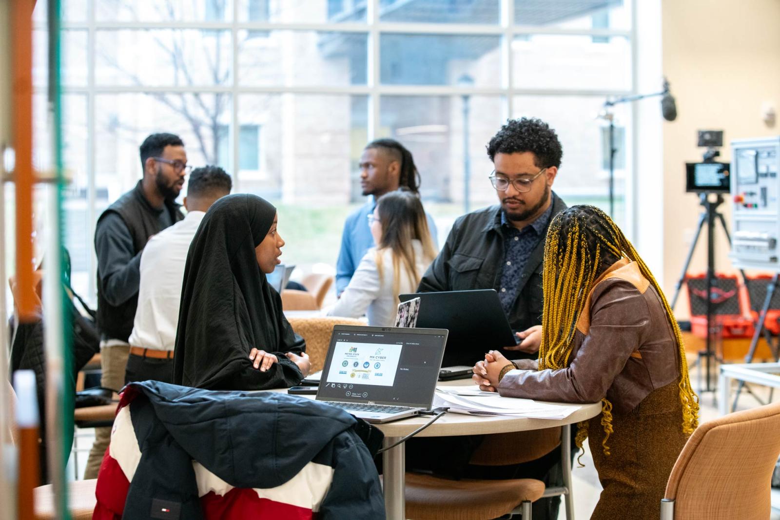 A group of students working around a table