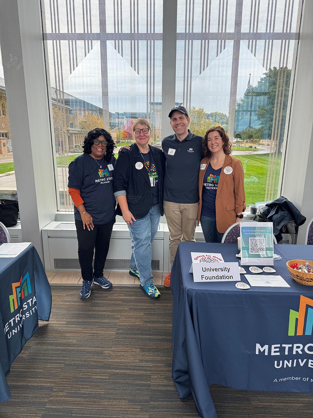 Volunteers pose for a portrait at Fall 2025 Grad Expo in the Great Hall