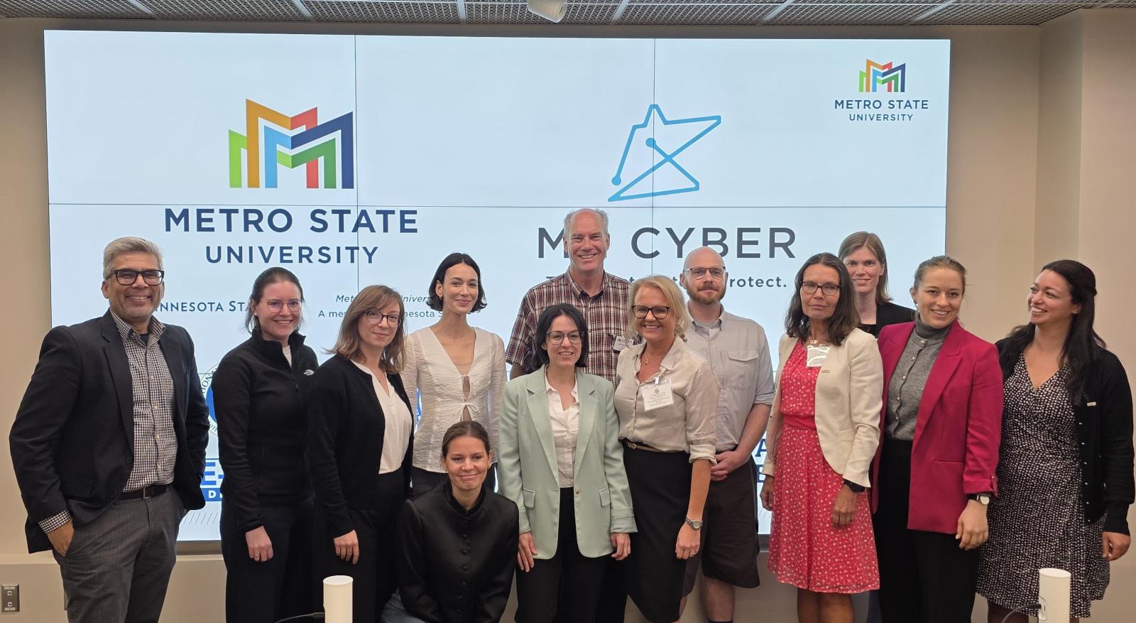 German and Swedish AI and Cybersecurity experts pose with Metro State hosts