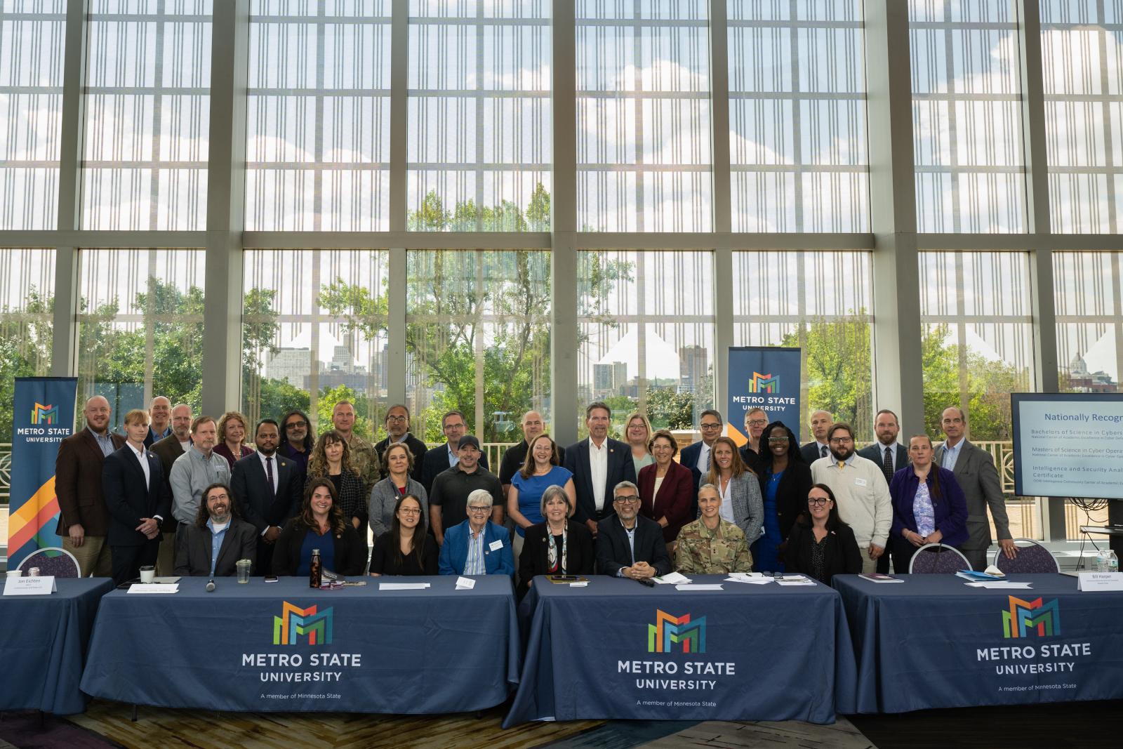 A large group photo taken in Metro State's New Main Great Hall