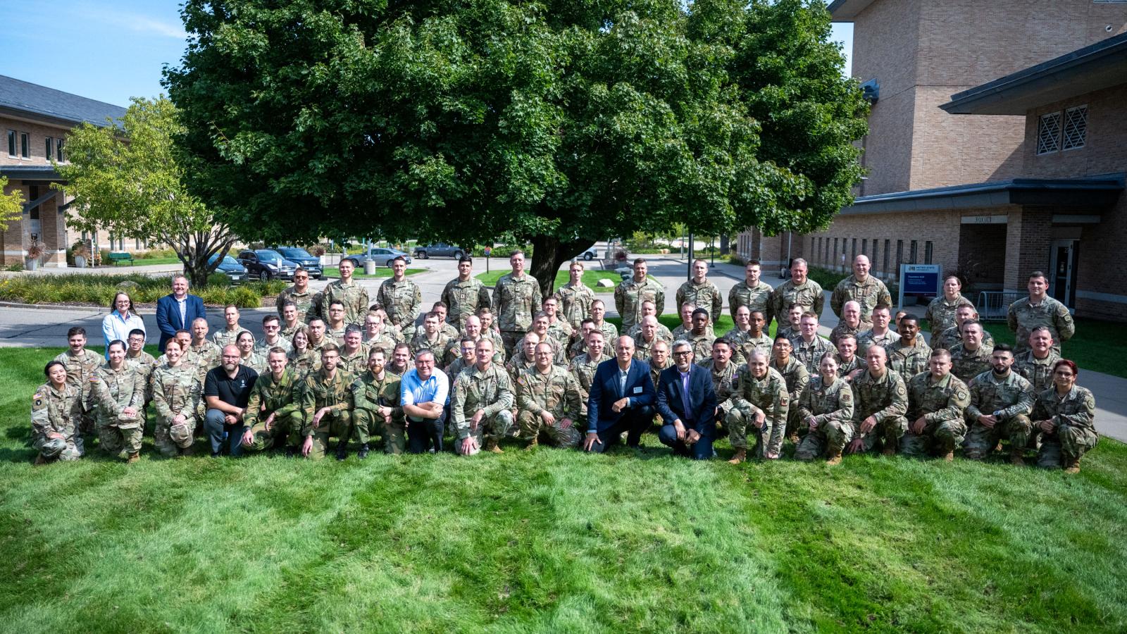 North Star Intelligence Community Colloquium participants gather for a group photo on the lawn in front of New Main