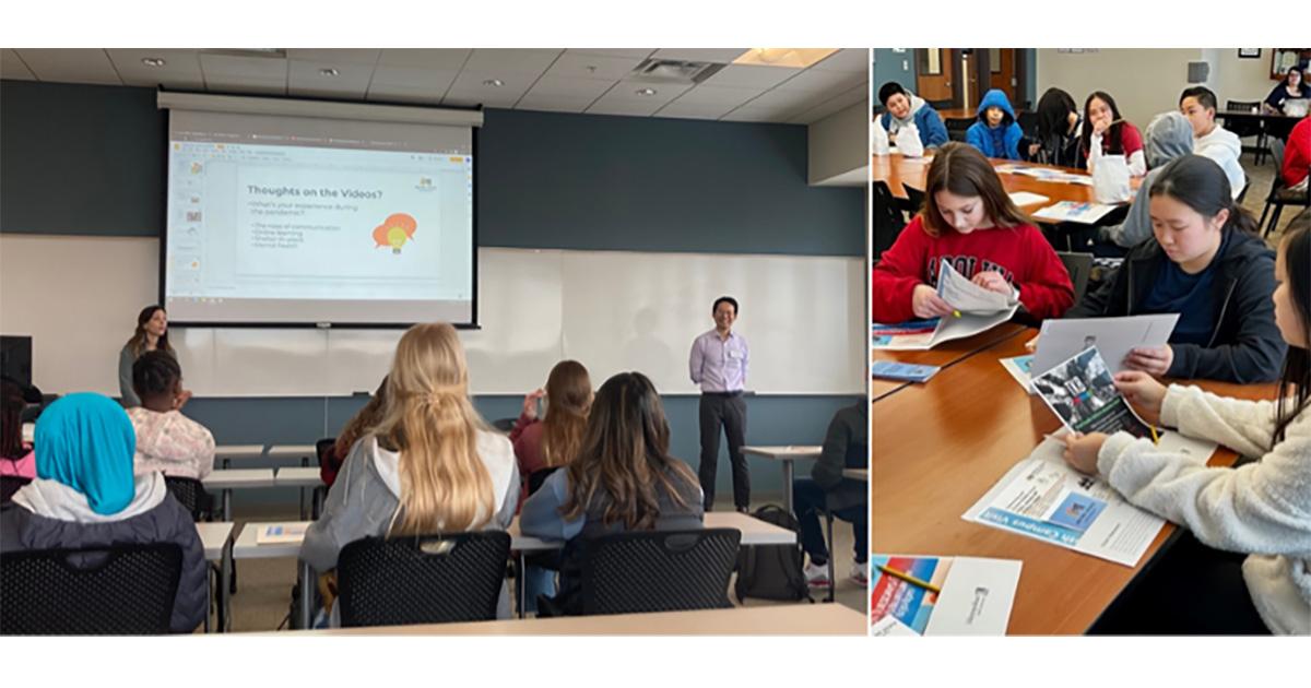 a class of students looks at a presentation on a screen and another class of students works together at a table