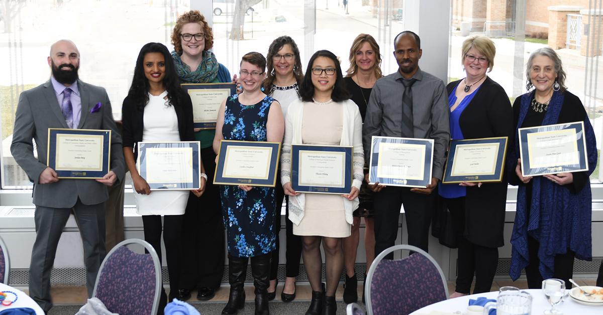Image shows large group of 2019 Outstanding Student award recipients standing in the Great Hall, on Metro State's Saint Paul campus.