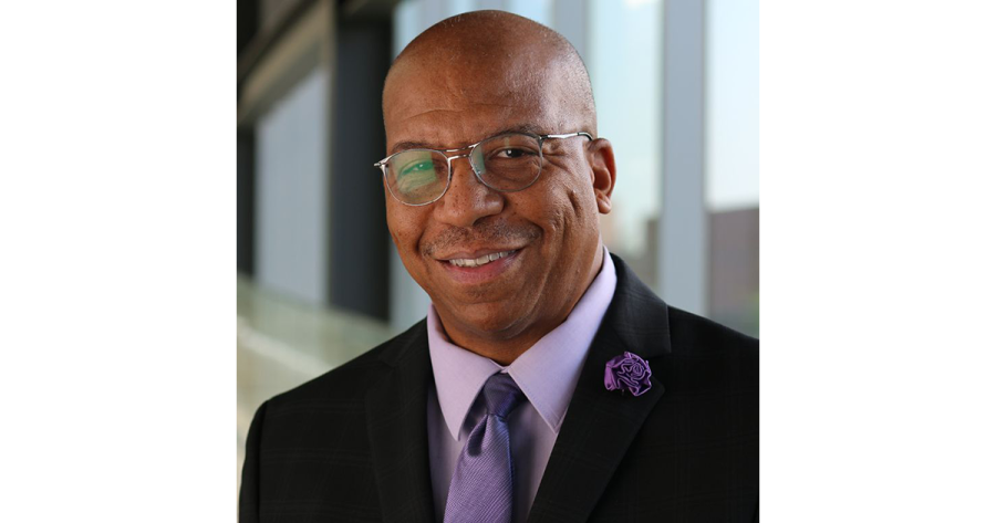 A portrait of a man in a suit and tie