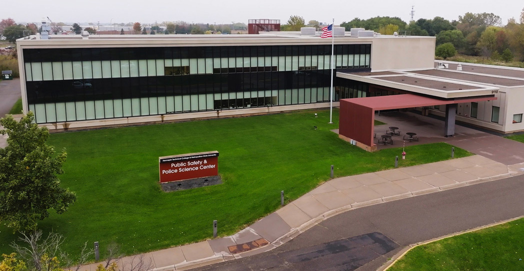 Aerial view of Metro State’s Public Safety and Police Science Center in Brooklyn Park, showing the building, lawn and main entrance.